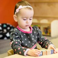 Reggio Emilia Childcare Centres | Chapter 1 – Parenting Child playing with blocks